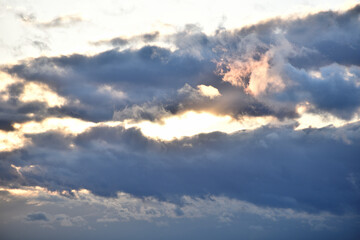 Naklejka na ściany i meble Beautiful dark blue clouds at twilight