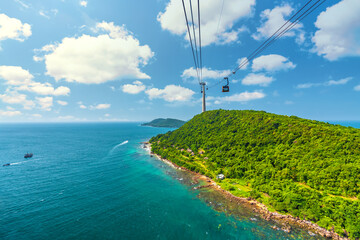 View of longest cable car ride in the world, Phu Quoc island, Vietnam. Below is seascape with tropical islands and boats. © huythoai