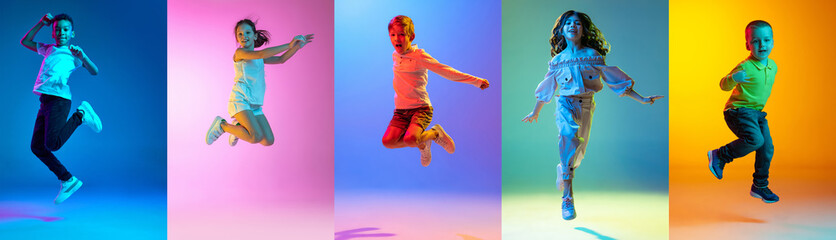 Group of elementary school and little kids or pupils jumping isolated in colorful on background in neon light. Creative collage. Back to school, education, childhood concept.