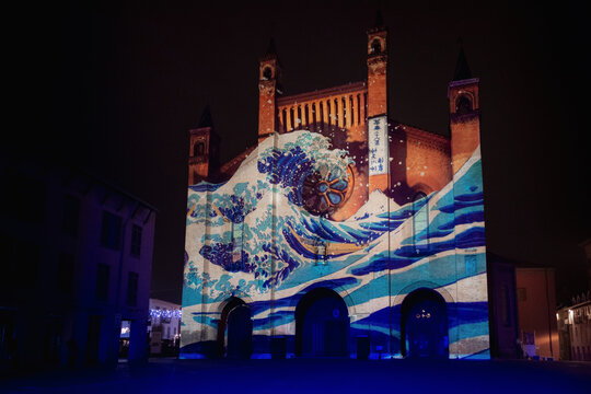 Alba, Italy – November 21, 2021 – Light mapping over the Saint Lawrence cathedral of Alba (Piedmont, Italy) with artistic paintings projected over the facade on november 2, 2021