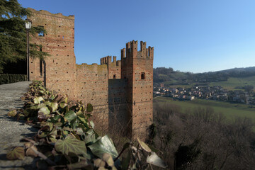 Winter exterior view from afar of the town of Castell’Arquato, medieval village in Emilia Romagna, beautiful contryside of italy with many castles between the cities of Parma and Piacenza