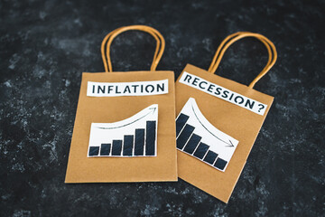 inflation and recession in economy, shopping bags with texts and graphs showing prices going up and growth going down