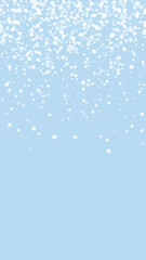 Snowy christmas background. Subtle flying snow flakes and stars on light blue winter backdrop. Delicate sweet snowy christmas. Vertical vector illustration.