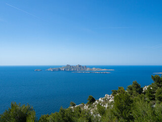 Fototapeta premium Calanques, France - May 20th 2020: Hiking high above the Mediterranean Sea along a rocky coast