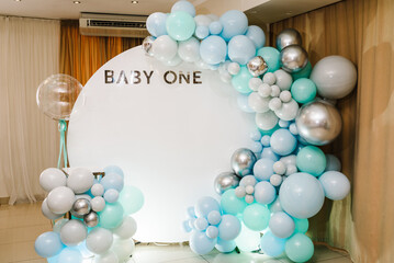 Arch decorated with blue, green, grey, and silver balloons. Baby one party. Trendy arch for 1 year....