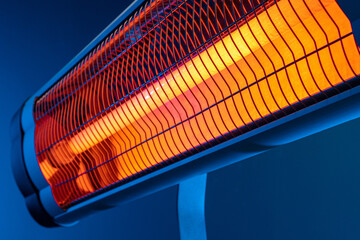 Modern electric infrared heater in the living room