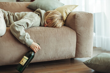 Drunk woman sleeping on a sofa