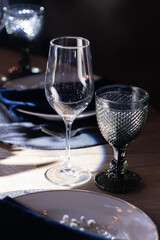 Glass goblets with decorative elements on the table