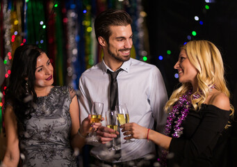 Office colegues celebrating new years eve
Drinking champagne 
feeling festive