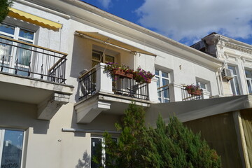 Cozy balconies in a white house on the Balaclava coast in Crimea