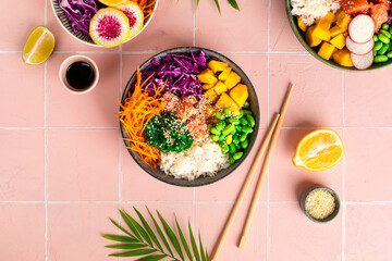Hawaiian poke bowl with salmon in a bowl with seaweed, sesame seeds and cabbage. Top view, flat lay,