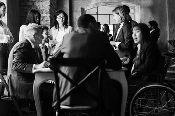 Diverse business people working inside office - Focus on senior asian woman face - Black and white editing