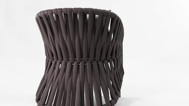 Luxurious chair with a futuristic rope weave on a white background. Insulated 