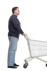 in full growth. casual mature man with shopping cart .