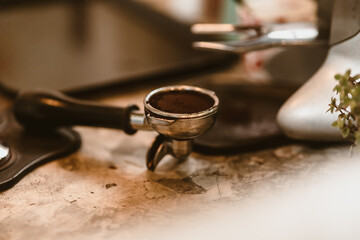 ground coffee in a portafilter. Coffee maker concept.
