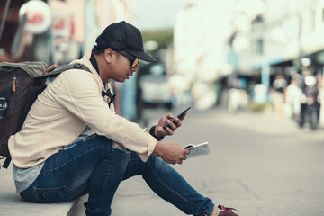 Tourists call to reserve a hotel or ask for directions from the side of the road. travel concept..