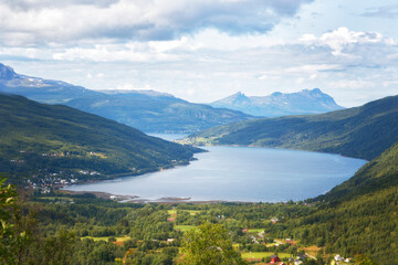 Fototapeta premium Beautiful summer Norwegian landscape with a lake and mountains