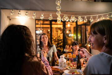 Multi-ethnic big family having fun, enjoy party outdoors in the garden