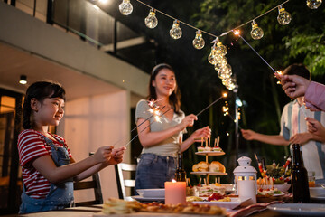 Multi-ethnic big family having fun, enjoy party outdoors in the garden