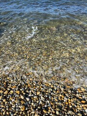 Beautiful sea pebble, transparent sea water