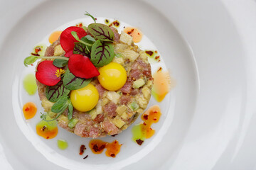 Salmon tartar with avocado and quail eggs