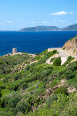 Fototapeta na wymiar Viewpoint of the coast of Teulada from the coastal road SP71, with the tower of Piscinnì, Sardinia