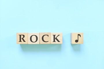 Rock music genre or style concept. Creative flat lay typography composition in blue background.