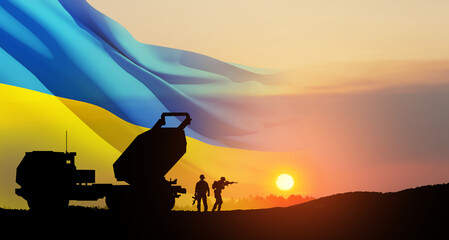 Artillery rocket system are aimed to the sky and soldiers at sunset with Ukrainian flag. Multiple...