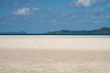 tourist walking on whitehaven beach in queensland. 