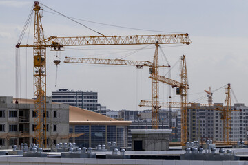 Fototapeta na wymiar construction cranes in the center of Astana