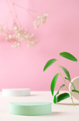 Gypsum podium for the presentation of cosmetic products. Green advertising stand with green leaves. Podium plan for the presentation of cosmetic products and exhibitions