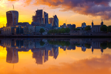 London cityscape with reflection from river Thames during sunset in England