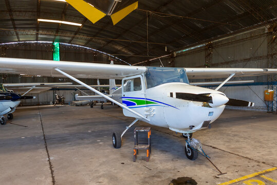 old angar with several airplanes ready for flight.