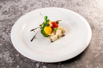 Vegan dish of camambert cheese with broccoli and herbs. Detox menu