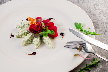 Healthy dish of goat cheese with vegetables. Vegetarian cuisine. Detox food