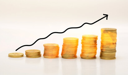 Concept of inflation with fire on coins and trend going upwards