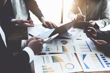 Business group people meeting and discuss to come up with conclusions on market, investment and marketing planning based on the financial budget provided by the company