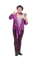in full growth.happy senior woman with gift box.