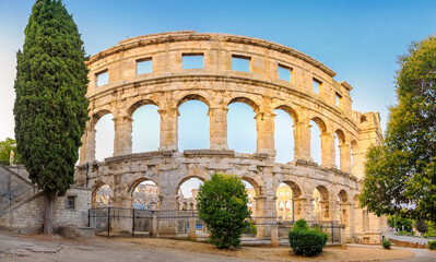 Panorama medieval Ancient Roman Amphitheater in Pula at dawn, Croatia. Architecture and landmark of...