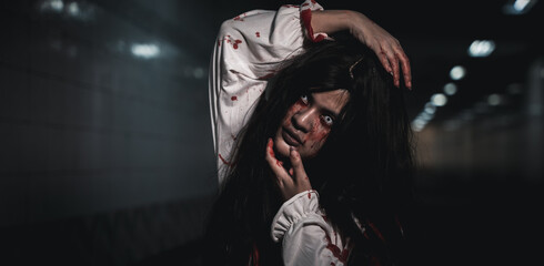 Horror bloodthirsty woman ghost or zombie she is horror scary with breaks her neck at dark night,...