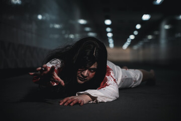 Horror Asian woman zombie with blood creepy crawling move slowly creeping out, Spooky ghost tousled...