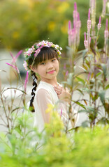 portrait of Beautiful Asian girl and cockscomb flower