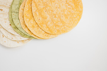 Spanish tomato, spinach flavored and plain wheat tortilla wraps on