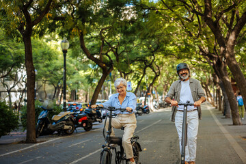 Stylish Caucasian couple with electric transport.