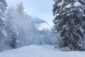 Artificial Snow Machine Making Snowflakes at Slope in Ski Resort Bansko, Bulgaria. Snowmaking Cannon