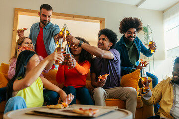 Friends socialize and toast with beers.