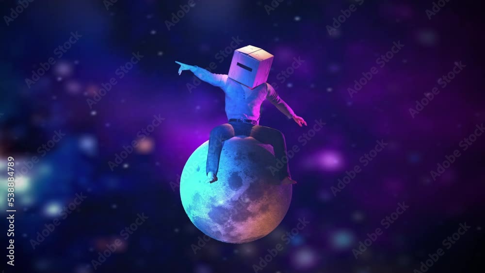 Wall mural man with box in his head sitting on the moon in the background the intergalactic universe.