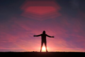 Fototapeta premium man trekking in the mountain with a sunset background in summertime