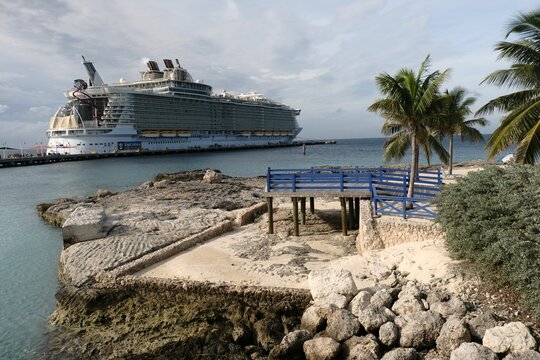 Oasis of the Seas cruise ship seen from the rocky shore in Cococay, Bahamas