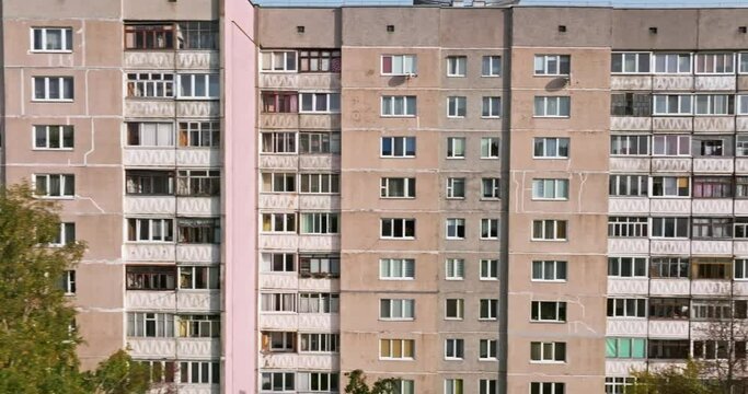 flight along a long multi-storey building with windows, balconies and loggias